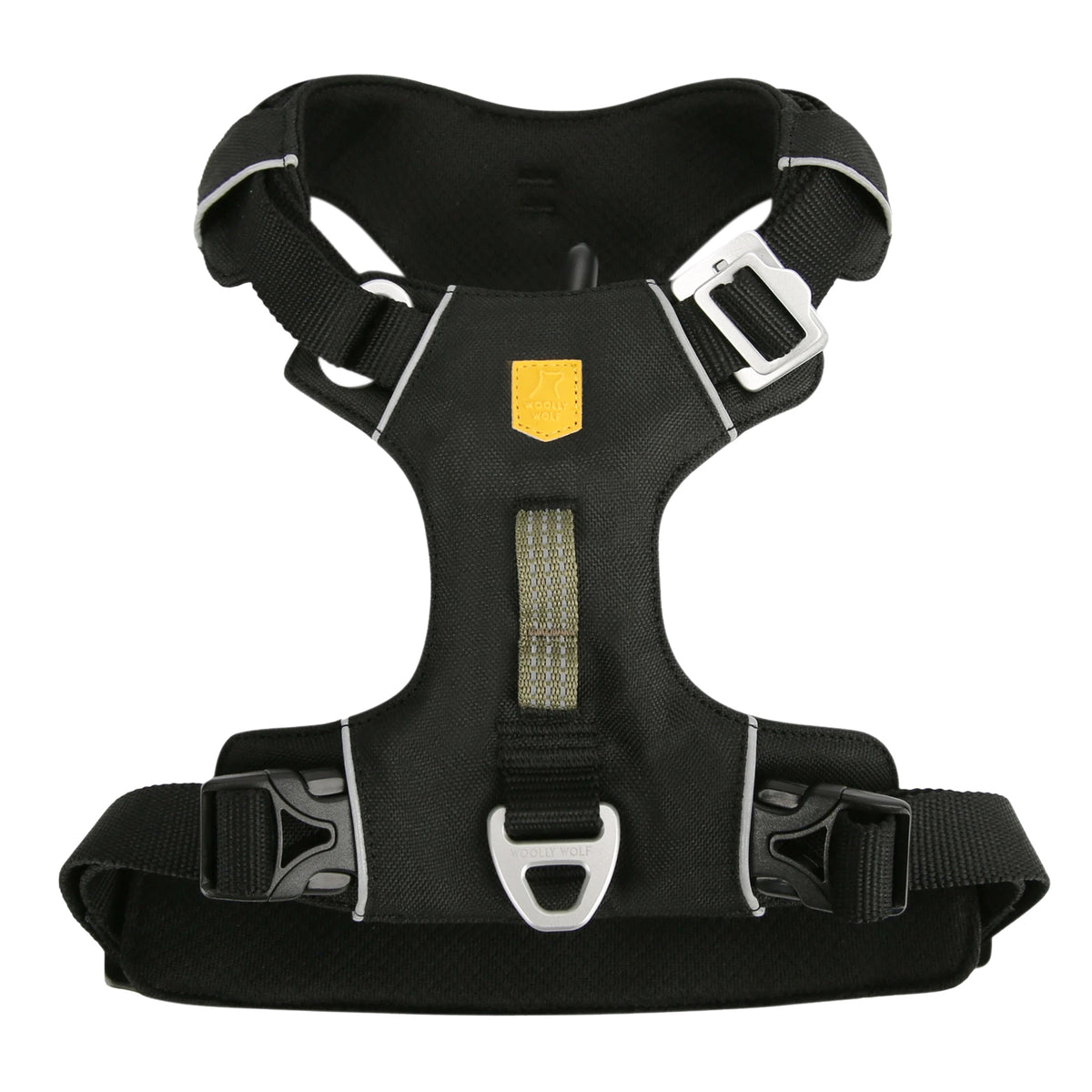 Black dog harness with a yellow logo patch and metal hardware.