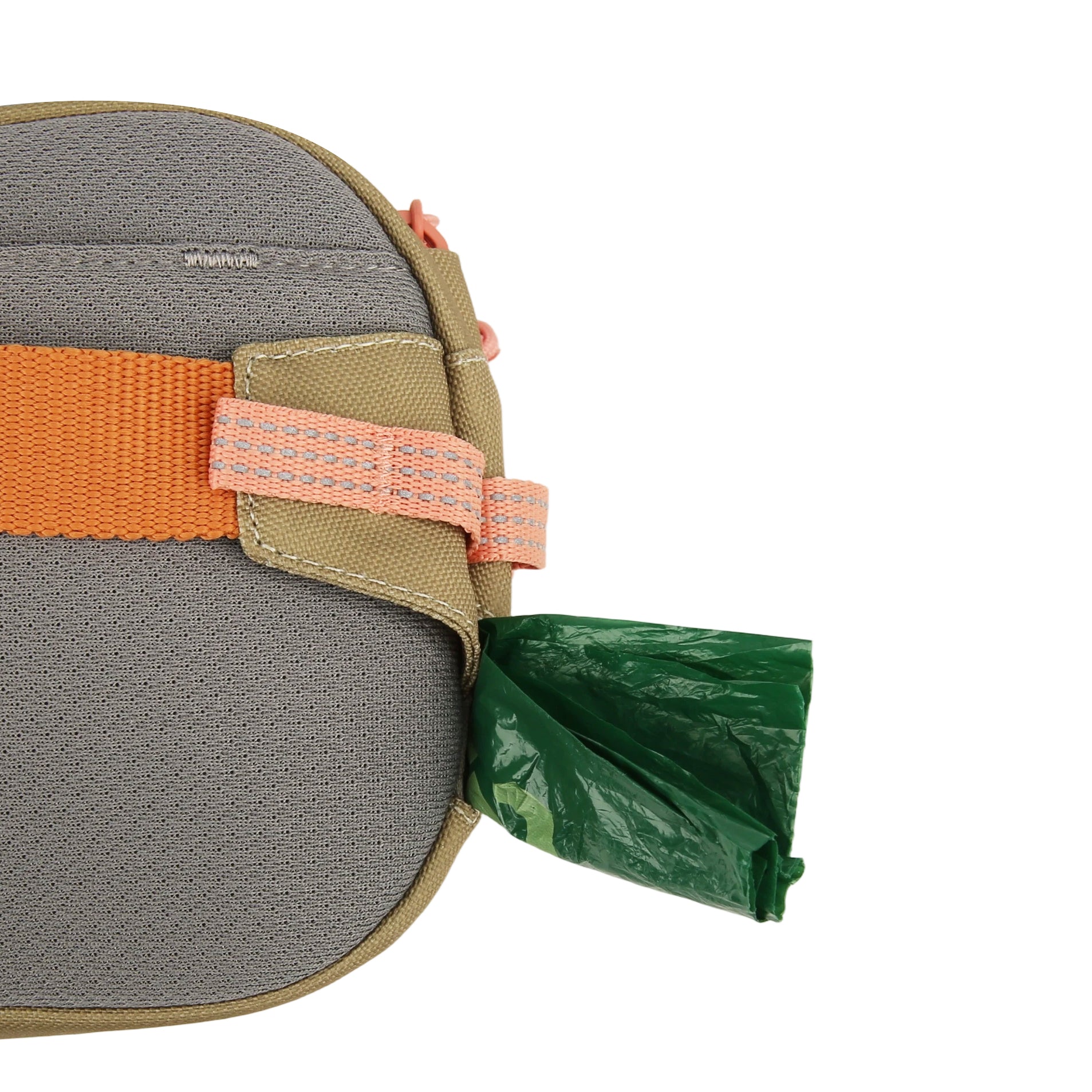 Gray and tan bag with an orange strap; a green waste bag is partially pulled out of a side dispenser.