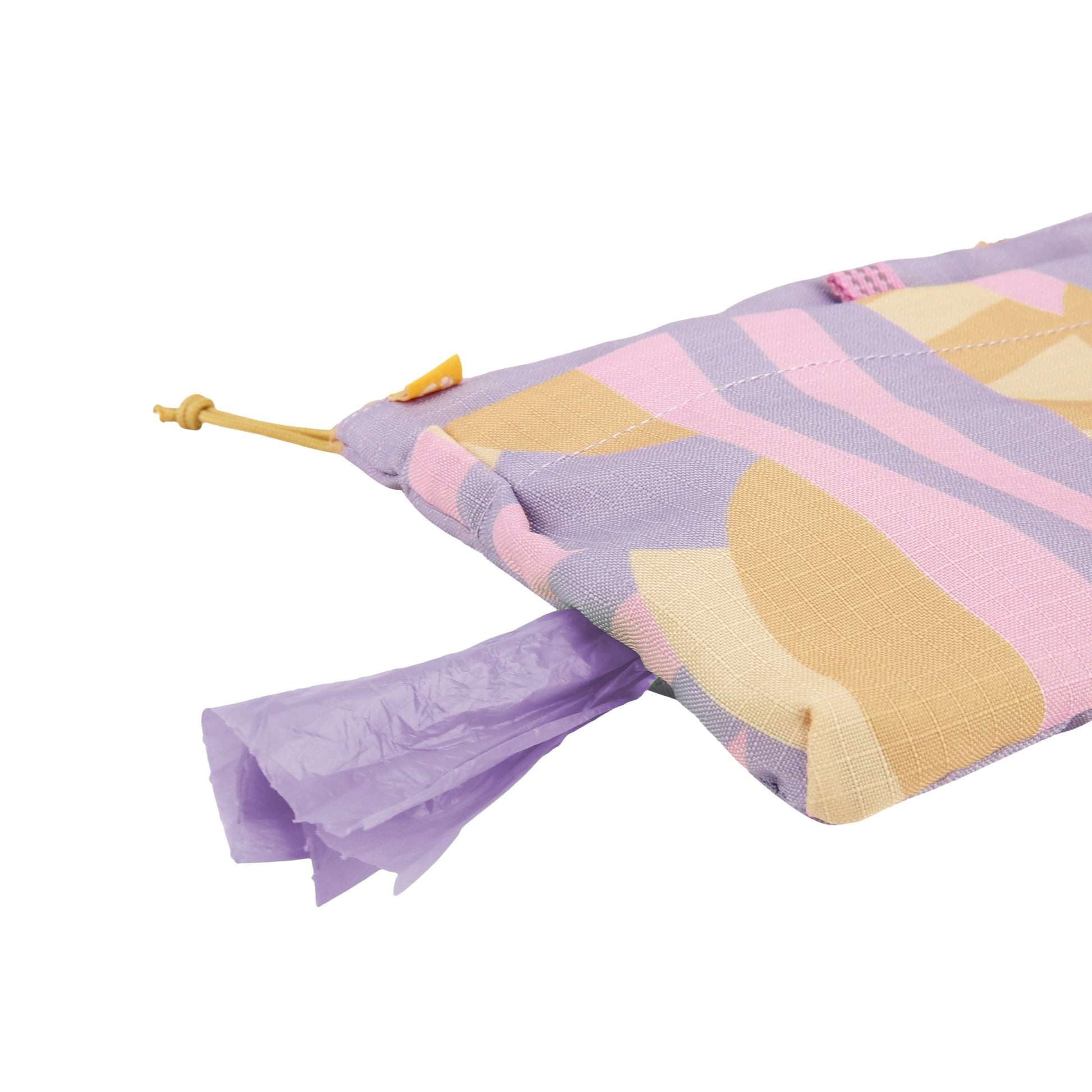 A patterned pouch with purple bags being dispensed from a small opening.