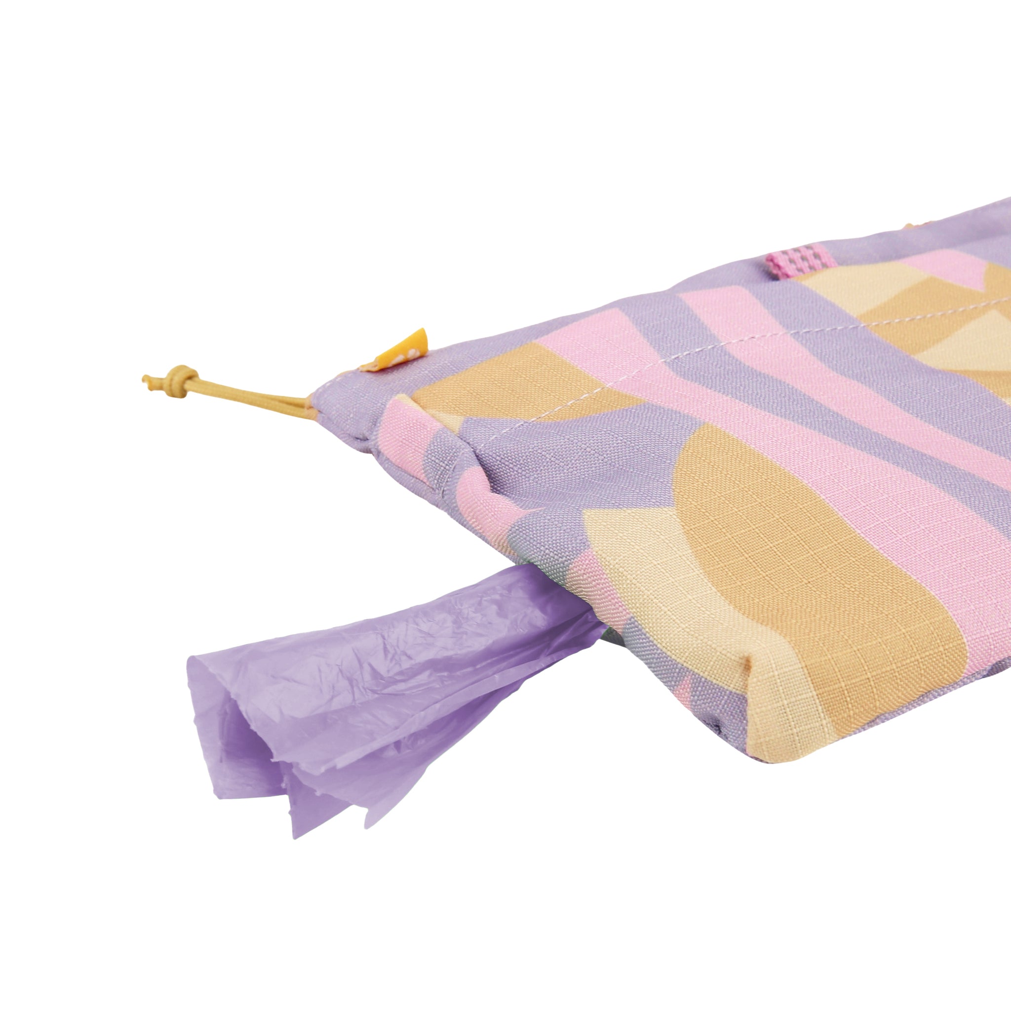 A patterned pouch with purple bags being dispensed from a small opening.