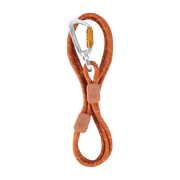 Orange rope leash with white accents, two leather tags, and a silver locking carabiner on a white background.